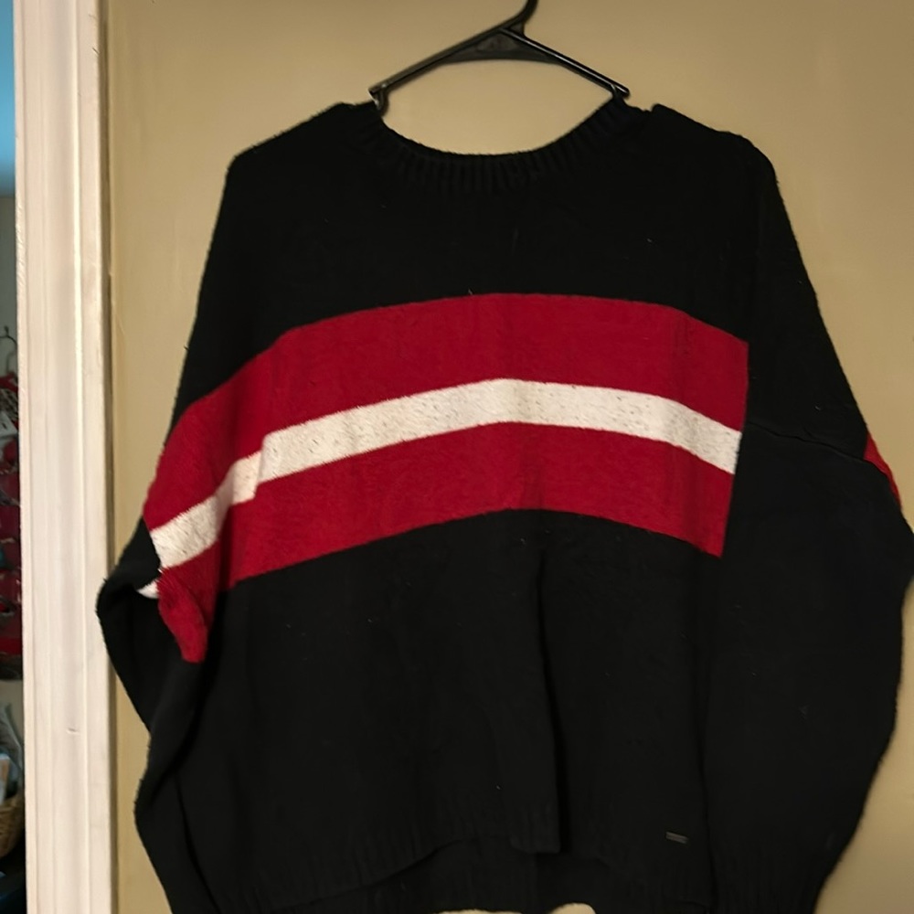 Dark blue sweater with red and white stripes very soft size medium